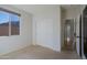 Well-lit bedroom with sliding closet doors and neutral wall colors at 4119 E Barwick Dr, Cave Creek, AZ 85331