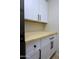 Laundry room with white cabinets and butcher block countertop at 4119 E Barwick Dr, Cave Creek, AZ 85331