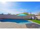 Relaxing pool area with patio and a blue umbrella at 4119 E Barwick Dr, Cave Creek, AZ 85331