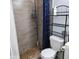 Clean bathroom with a shower/tub combo and shelving at 4131 N 55Th Dr, Phoenix, AZ 85031