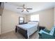 Bedroom with double bed, ceiling fan and chair at 4131 N 55Th Dr, Phoenix, AZ 85031