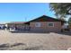 Ranch style home with a gravel front yard and a tree at 4131 N 55Th Dr, Phoenix, AZ 85031