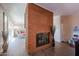 Brick fireplace in living room, open to other areas at 4131 N 55Th Dr, Phoenix, AZ 85031