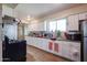 Modern kitchen with white cabinets and stainless steel appliances at 4131 N 55Th Dr, Phoenix, AZ 85031