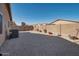 Large backyard with gravel landscaping and block wall at 43568 W Bedford Dr, Maricopa, AZ 85138