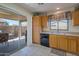 Kitchen features a sliding door to backyard patio at 43568 W Bedford Dr, Maricopa, AZ 85138