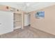 Bedroom with carpet, a closet and a tropical-themed wall art at 437 E Marconi Ave, Phoenix, AZ 85022