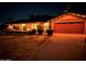 Evening view of the house exterior with festive lights at 437 E Marconi Ave, Phoenix, AZ 85022