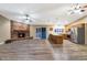 Spacious living room features a stone fireplace and hardwood floors at 437 E Marconi Ave, Phoenix, AZ 85022