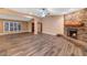 Living room with stone fireplace and hardwood floors at 437 E Marconi Ave, Phoenix, AZ 85022