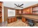 Home office with built-in wood cabinets and granite countertops at 437 E Marconi Ave, Phoenix, AZ 85022