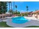 Inviting kidney-shaped pool with a large surrounding patio at 437 E Marconi Ave, Phoenix, AZ 85022