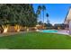 Landscaped backyard oasis featuring a sparkling pool at 437 E Marconi Ave, Phoenix, AZ 85022