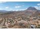 Wide aerial view of the neighborhood and mountain at 47435 N Meander Rd, New River, AZ 85087