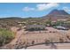 Aerial view of house and surrounding desert landscape at 47435 N Meander Rd, New River, AZ 85087