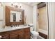 Bathroom with granite countertop and wood cabinets at 47435 N Meander Rd, New River, AZ 85087