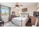 Cozy bedroom with rustic bed frame and wood floors at 47435 N Meander Rd, New River, AZ 85087