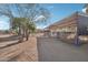 Covered stalls and corral area providing ample space for horses at 47435 N Meander Rd, New River, AZ 85087