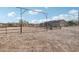 Ranch home exterior with gated corral, showcasing rustic charm and desert setting at 47435 N Meander Rd, New River, AZ 85087