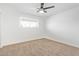 Bright bedroom with neutral carpeting and ceiling fan at 501 W Linda Ln, Chandler, AZ 85225