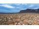 Aerial view of a neighborhood with desert landscape and distant mountains at 5089 E 26Th Ave, Apache Junction, AZ 85119