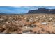 Aerial view of a desert property with a house and distant mountains at 5089 E 26Th Ave, Apache Junction, AZ 85119