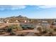 Aerial view of house, detached garage, and expansive desert lot at 5089 E 26Th Ave, Apache Junction, AZ 85119