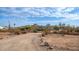 House exterior view with a gravel driveway at 5089 E 26Th Ave, Apache Junction, AZ 85119