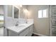 Bathroom with double vanity, quartz countertop, and updated fixtures at 5089 E 26Th Ave, Apache Junction, AZ 85119