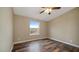 Simple bedroom with wood-look floors and a window at 5089 E 26Th Ave, Apache Junction, AZ 85119