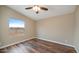 Spacious bedroom featuring wood floors and a window at 5089 E 26Th Ave, Apache Junction, AZ 85119