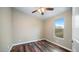 Bright bedroom with hardwood floors and a large window at 5089 E 26Th Ave, Apache Junction, AZ 85119