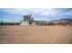 House exterior with covered porch and desert landscape at 5089 E 26Th Ave, Apache Junction, AZ 85119