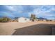 House exterior with gravel yard and mountain backdrop at 5089 E 26Th Ave, Apache Junction, AZ 85119