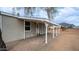 House exterior showcasing a covered patio and landscaping at 5089 E 26Th Ave, Apache Junction, AZ 85119