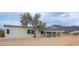 Single story home with desert landscaping and mountain views at 5089 E 26Th Ave, Apache Junction, AZ 85119