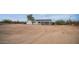 House exterior with covered porch and desert landscape at 5089 E 26Th Ave, Apache Junction, AZ 85119