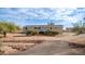 House exterior with a rock garden and gravel driveway at 5089 E 26Th Ave, Apache Junction, AZ 85119