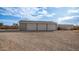 Three-car garage with gravel driveway at 5089 E 26Th Ave, Apache Junction, AZ 85119