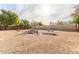 Large backyard with gravel and a wooden fence at 5519 W Elgin St, Chandler, AZ 85226