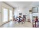 Bright dining area with wood table and chairs, and access to backyard at 5519 W Elgin St, Chandler, AZ 85226