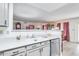 Kitchen sink and dishwasher with view into living room at 5519 W Elgin St, Chandler, AZ 85226