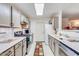 Galley kitchen with stainless steel appliances and ample cabinetry at 5519 W Elgin St, Chandler, AZ 85226