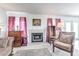 Living room with fireplace, wood furniture, and a large rug at 5519 W Elgin St, Chandler, AZ 85226