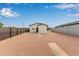 Spacious backyard with gravel and a modern fence at 562 N Lewis --, Mesa, AZ 85201