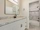 Bathroom with white vanity, granite countertop, and marble shower at 562 N Lewis --, Mesa, AZ 85201