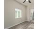 Bedroom with ceiling fan, window blinds, and view of bathroom at 562 N Lewis --, Mesa, AZ 85201