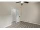 Bright bedroom with ceiling fan, window blinds and grey flooring at 562 N Lewis --, Mesa, AZ 85201