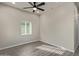 Spacious living room featuring hardwood floors and a ceiling fan at 562 N Lewis --, Mesa, AZ 85201