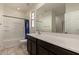 Bathroom with shower, tub, and dark brown vanity at 5656 N 109Th Ave, Phoenix, AZ 85037